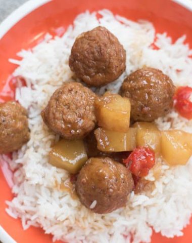 A plate of food, with Meatball