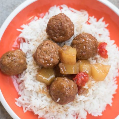 A plate of food, with Meatball